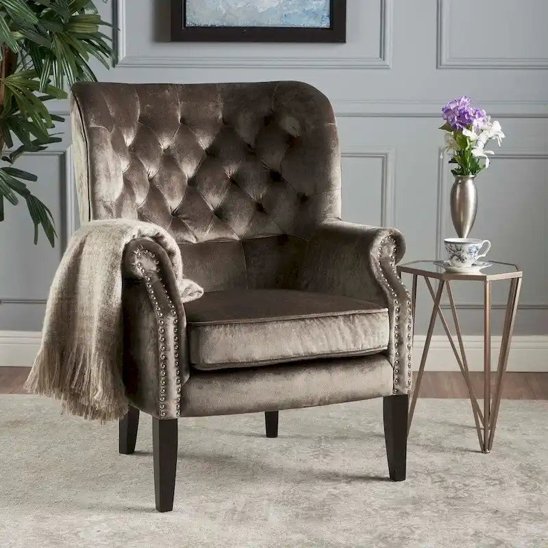Fauteuil club en velours clouté