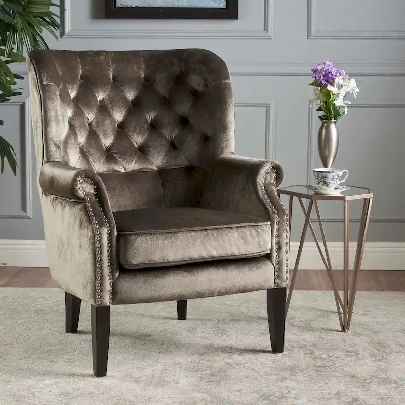Fauteuil club en velours clouté