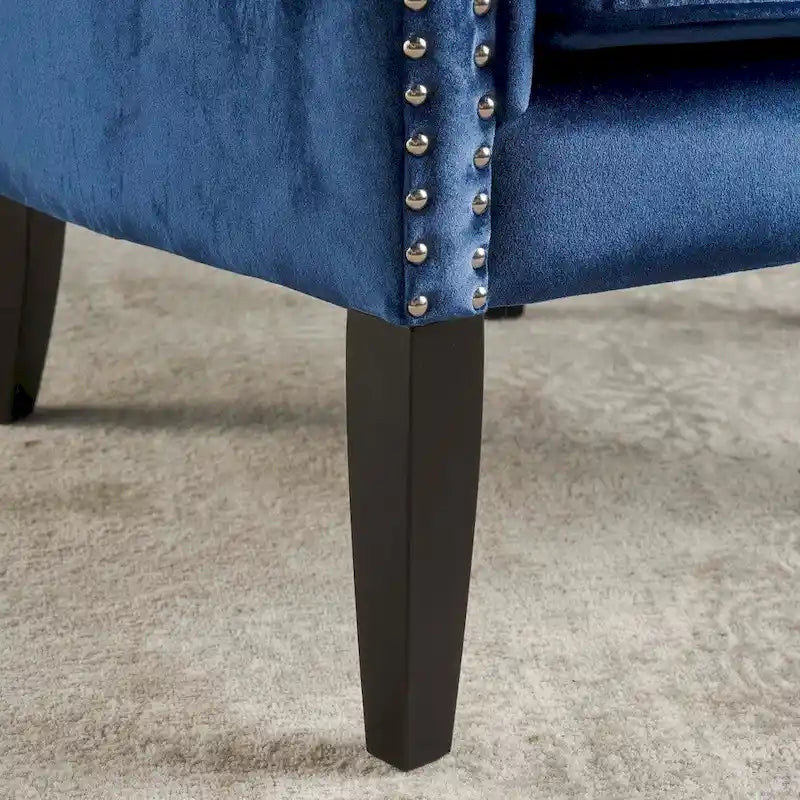 Fauteuil club en velours clouté