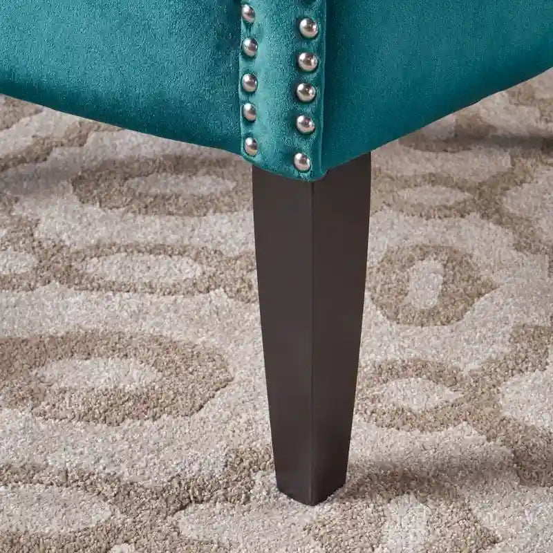 Fauteuil club en velours clouté