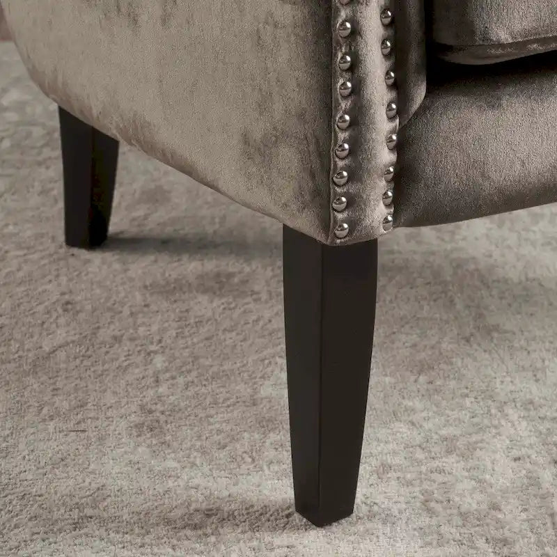 Fauteuil club en velours clouté